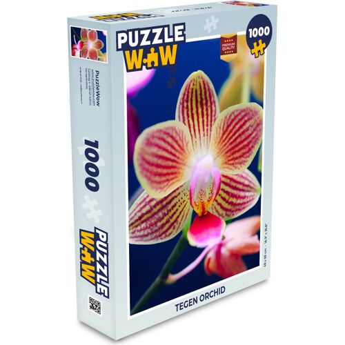 Puzzleverpackung mit Orchideenbild, 1000 Teile. Puzzleverpackung mit Orchideenbild, 1000 Teile.