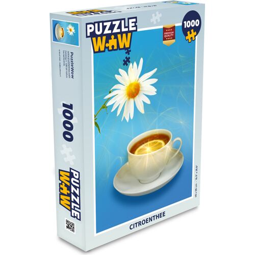 Puzzle-Box mit Kamillenblume und Teetasse auf blauem Hintergrund Puzzle-Box mit Kamillenblume und Teetasse auf blauem Hintergrund